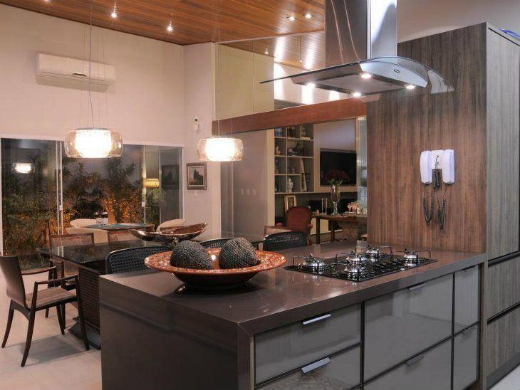 cozinha integrada com detalhes em granito marrom absoluto